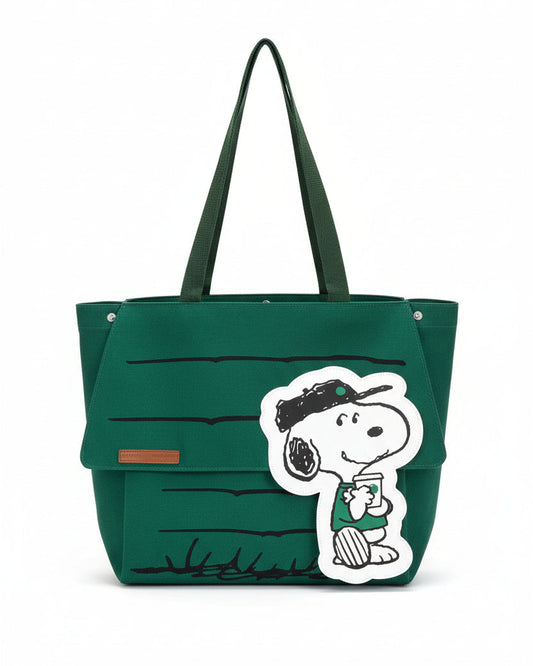 Green tote bag with a Peanuts Snoopy character design on a white background