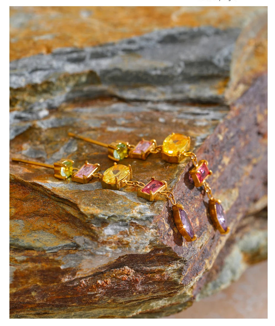 Jewellery set with gemstones on a stone surface, text overlay about jewellery.