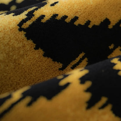 Close-up of a textured fabric with black and yellow pattern