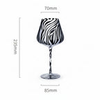 Black and white patterned wine glass with measurements on a white background