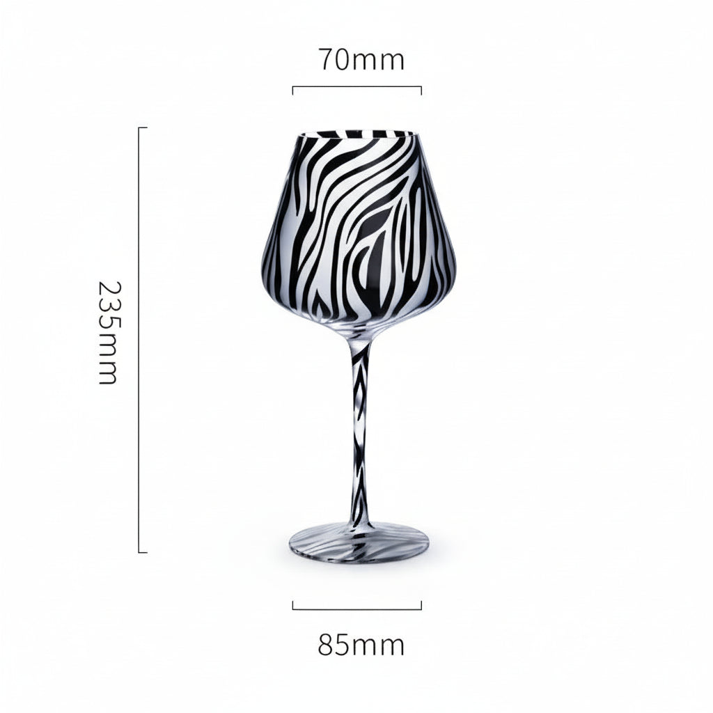 Black and white patterned wine glass with measurements on a white background