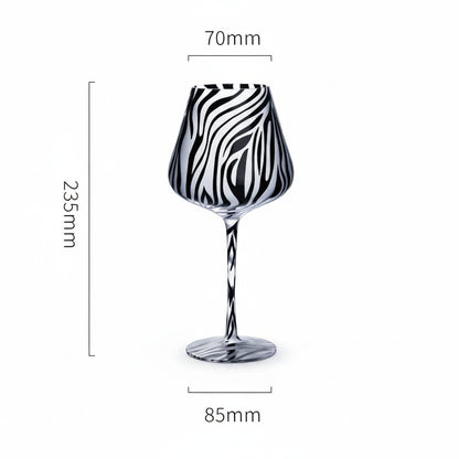 Black and white patterned wine glass with measurements on a white background