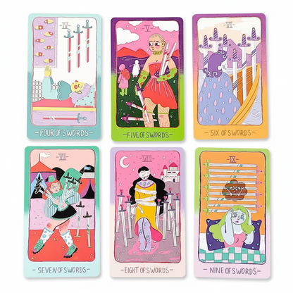 Set of colorful tarot cards displayed on a white surface 