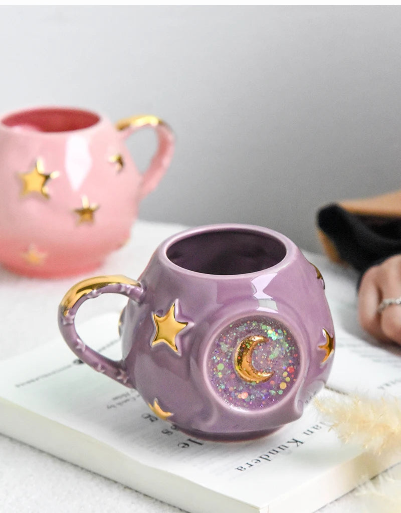 Purple mug with star and moon design on a white surface