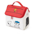 A Snoopy House Peanuts makeup toiletries travel bag with a white base color and red details, featuring character illustrations from the Peanuts comic.